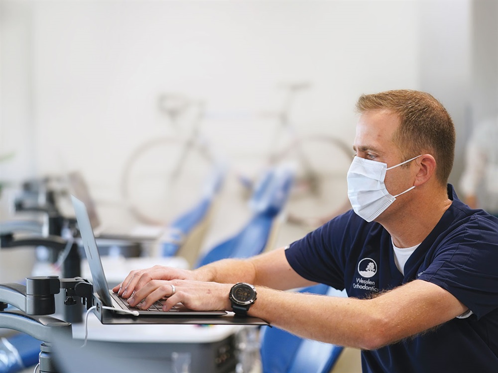Dr. Wesslen reviewing a case at the chairside computer
