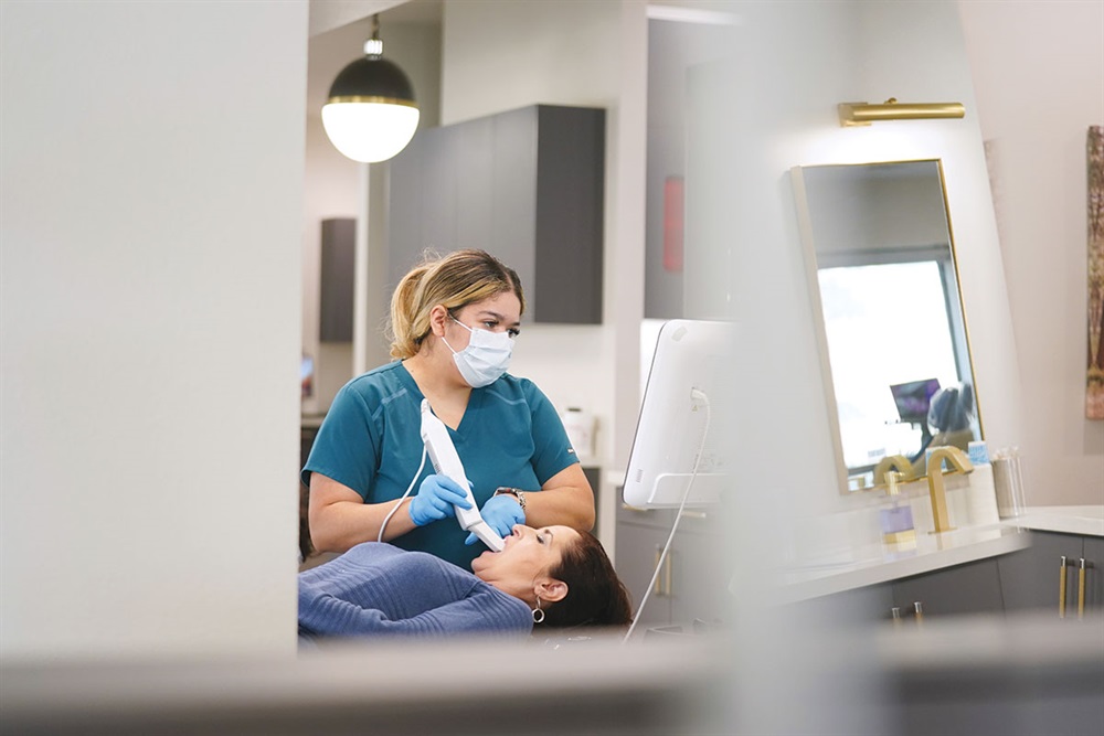 Team member taking a digital intraoral scan